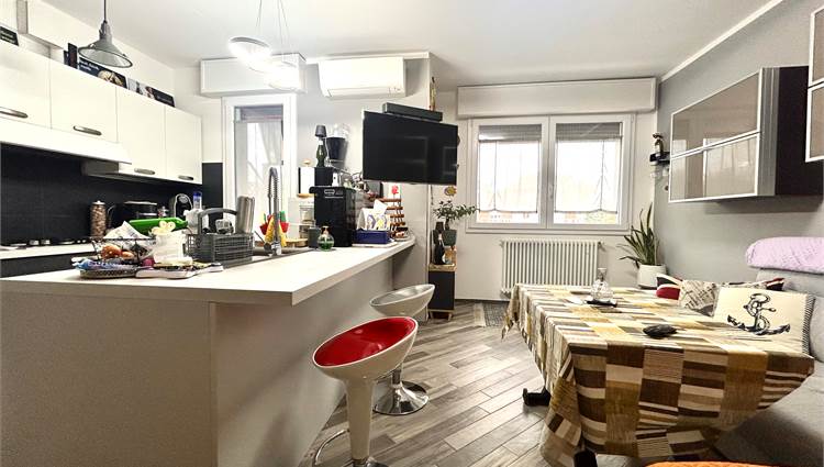 soggiorno con angolo cottura