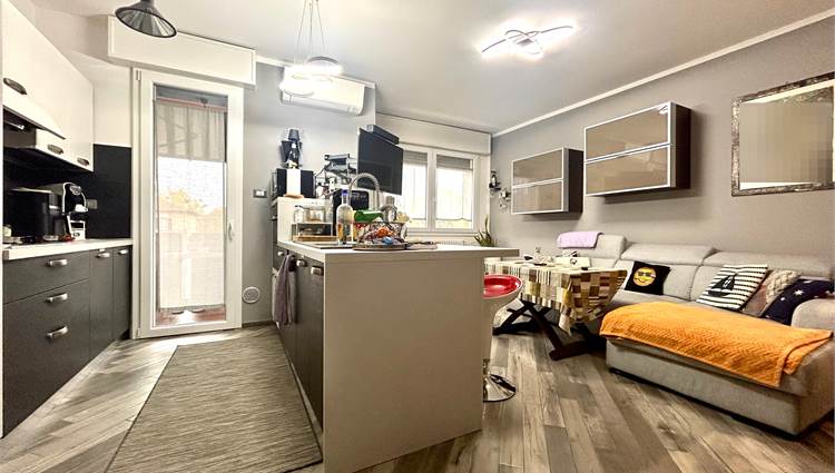 soggiorno con angolo cottura